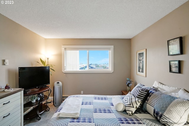 carpeted bedroom featuring a textured ceiling