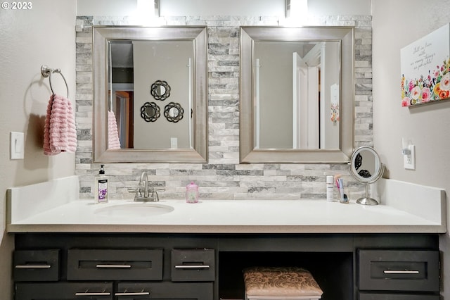 bathroom featuring tasteful backsplash and oversized vanity