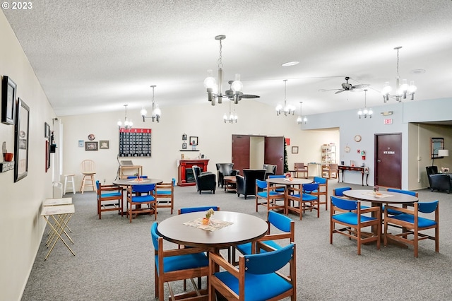 dining space featuring a textured ceiling, light colored carpet, and ceiling fan with notable chandelier