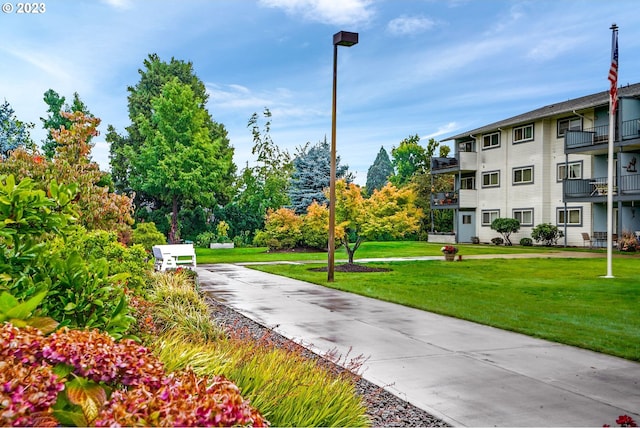 view of home's community featuring a yard