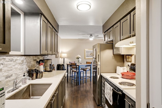 kitchen with dark hardwood / wood-style floors, custom range hood, sink, ceiling fan, and white range with electric cooktop