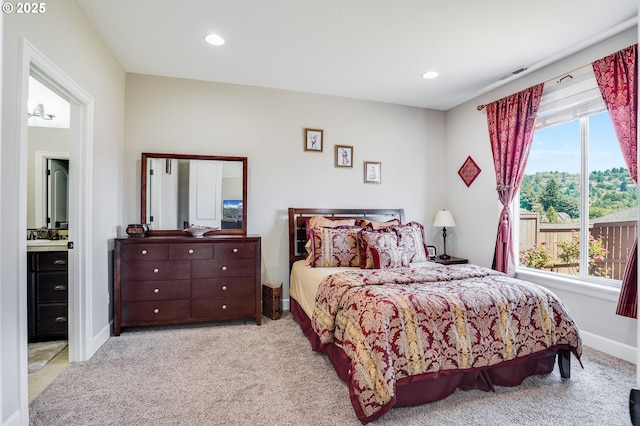 10703 NW Glenmore Way, Portland, OR 97229 - carpeted bedroom featuring recessed lighting and baseboards