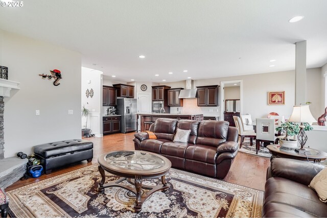 10703 NW Glenmore Way, Portland, OR 97229 - living area with light wood-style floors and recessed lighting