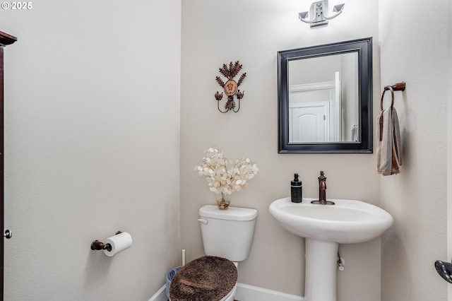 10703 NW Glenmore Way, Portland, OR 97229 - half bathroom featuring toilet and baseboards