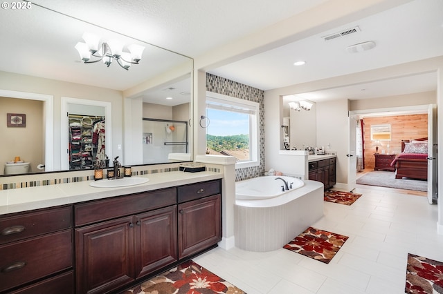 10703 NW Glenmore Way, Portland, OR 97229 - full bathroom featuring a chandelier, a bath, vanity, a spacious closet, and a stall shower