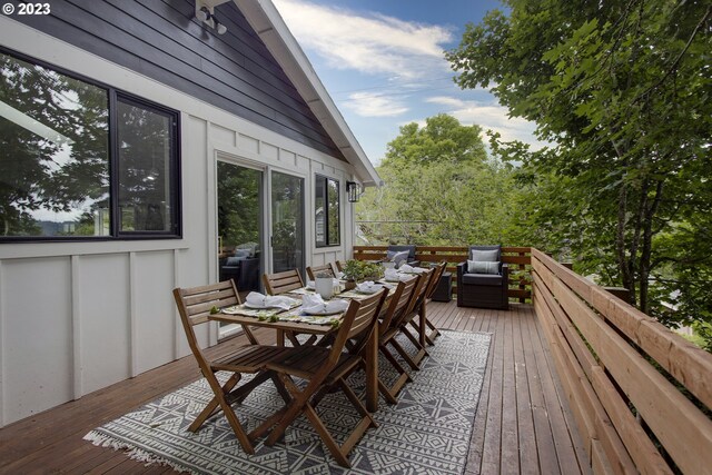 wooden terrace featuring an outdoor living space