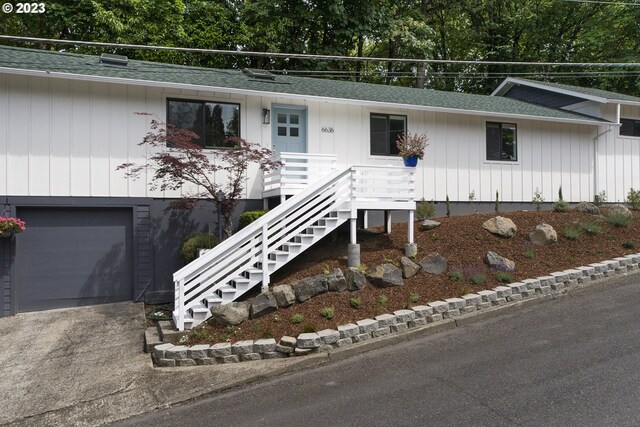 ranch-style home featuring a garage