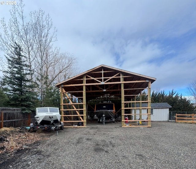 view of outbuilding with an outbuilding and fence