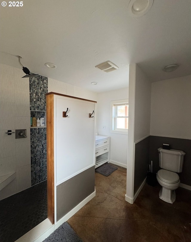 full bath with visible vents, baseboards, toilet, and a walk in shower