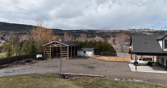 exterior space with an outbuilding and fence