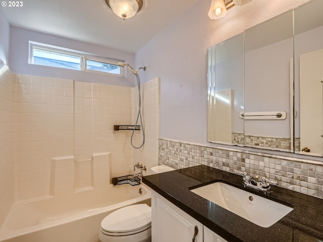 full bathroom with bathtub / shower combination, toilet, tasteful backsplash, and vanity