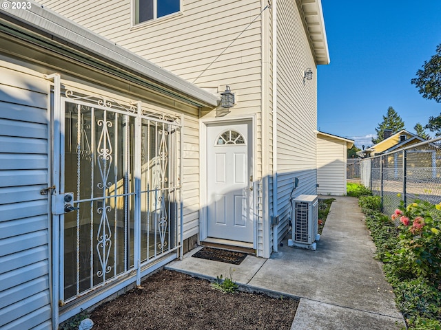 doorway to property with central AC unit