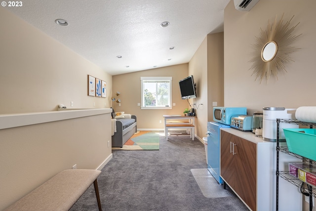 interior space with a textured ceiling and lofted ceiling