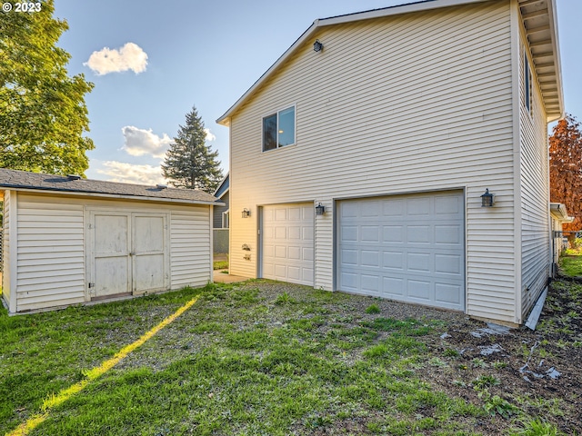 garage with a yard