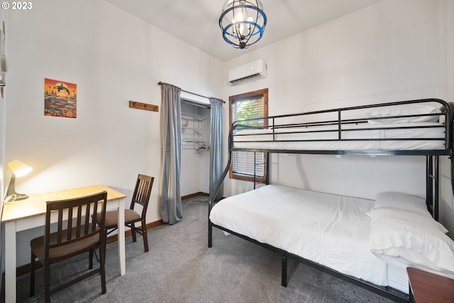 bedroom featuring a chandelier, dark colored carpet, and an AC wall unit