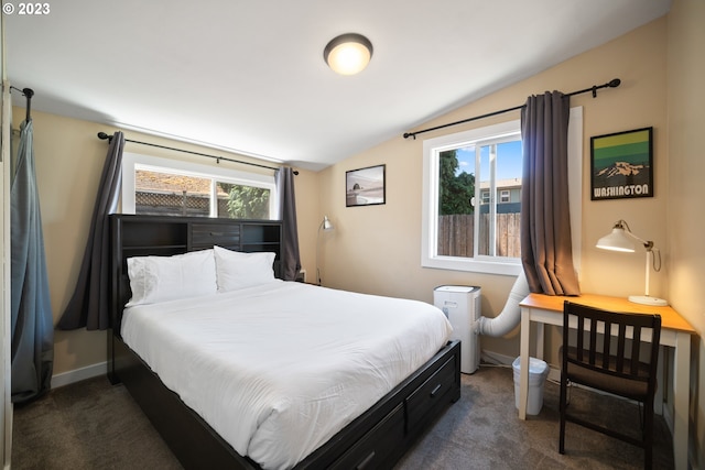 carpeted bedroom with lofted ceiling