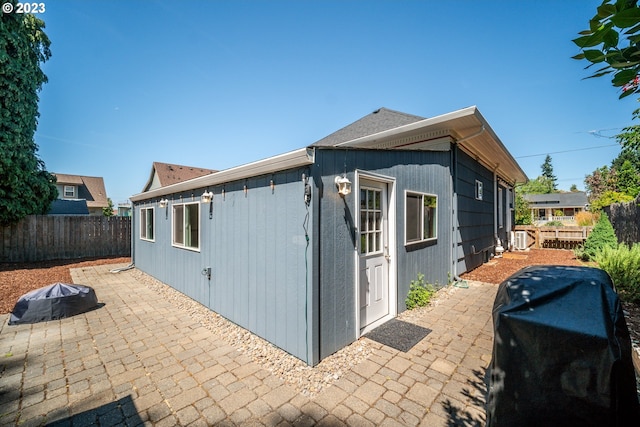 view of side of property featuring a patio area