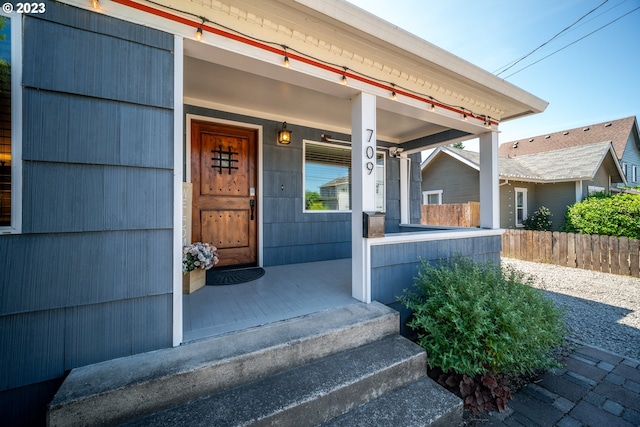 property entrance featuring a porch