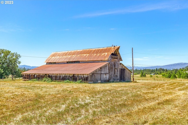 exterior space with a mountain view and a rural view