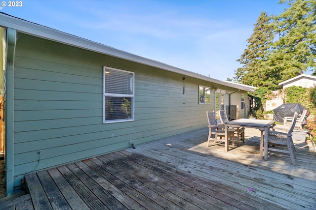 wooden deck with grilling area