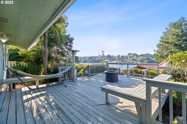 wooden deck with a water view