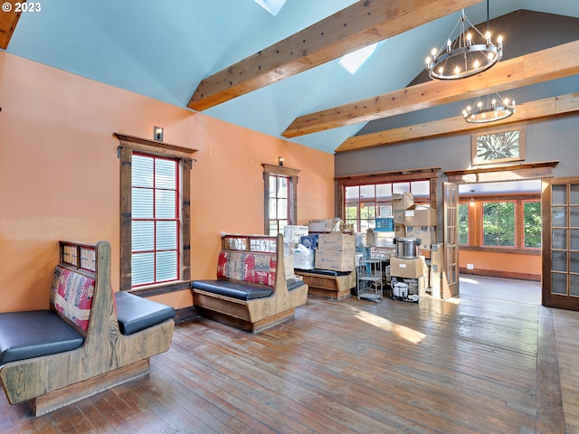 sitting room with a chandelier, high vaulted ceiling, a skylight, beamed ceiling, and dark hardwood / wood-style floors