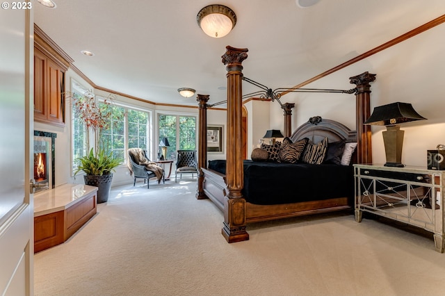 bedroom with crown molding and light colored carpet