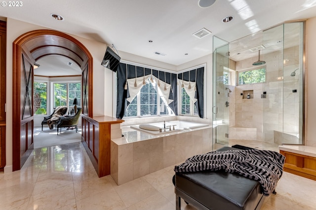 bathroom featuring tile flooring and plus walk in shower