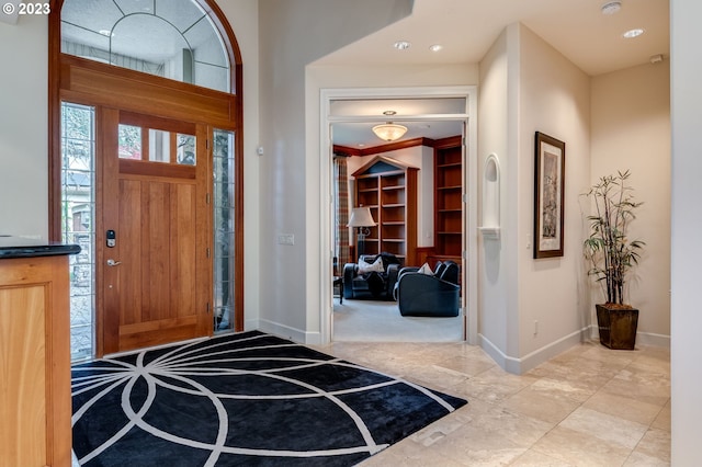 view of carpeted foyer