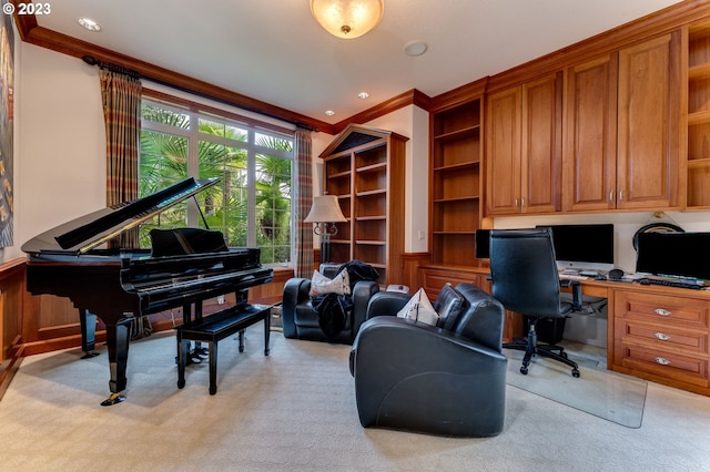 office area featuring built in desk, ornamental molding, and light carpet