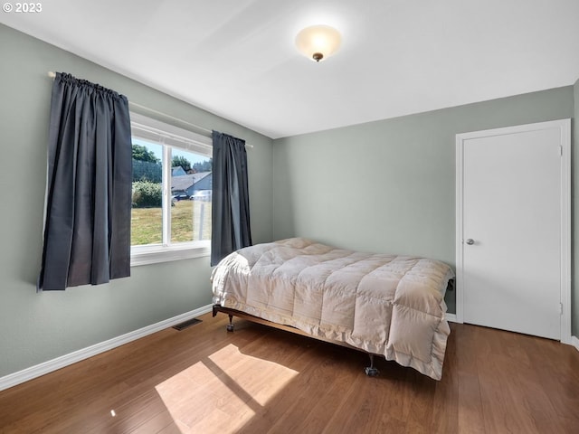 bedroom featuring hardwood / wood-style flooring