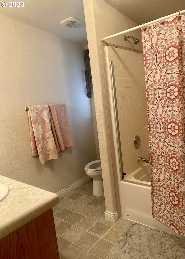 full bathroom featuring shower / tub combo, vanity, tile flooring, and toilet