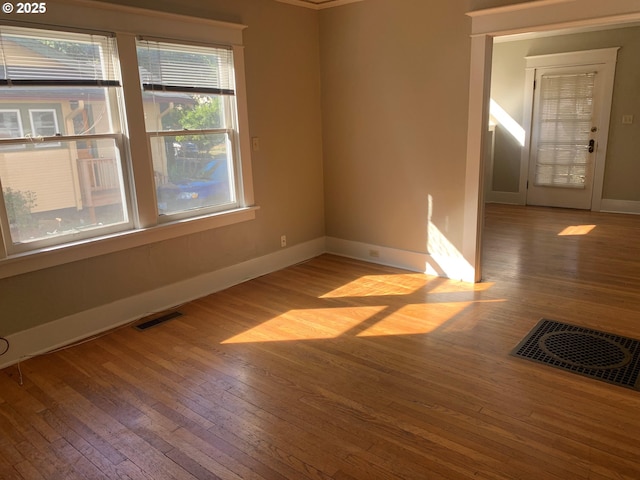 unfurnished room featuring wood-type flooring