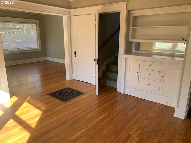 unfurnished bedroom featuring hardwood / wood-style floors