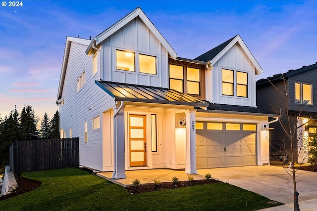 17007 NE 82nd St, Vancouver, WA 98682 - modern inspired farmhouse with board and batten siding, fence, driveway, an attached garage, and a standing seam roof