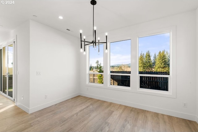 17007 NE 82nd St, Vancouver, WA 98682 - unfurnished dining area with a notable chandelier, wood finished floors, visible vents, and baseboards