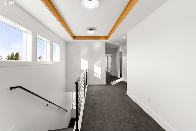 17007 NE 82nd St, Vancouver, WA 98682 - hallway featuring a raised ceiling, an upstairs landing, dark colored carpet, and baseboards