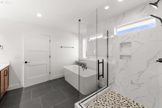 17007 NE 82nd St, Vancouver, WA 98682 - full bathroom with vanity, a soaking tub, baseboards, and a marble finish shower