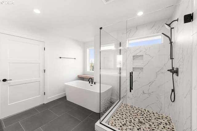 17007 NE 82nd St, Vancouver, WA 98682 - bathroom with a marble finish shower, a soaking tub, a healthy amount of sunlight, and recessed lighting
