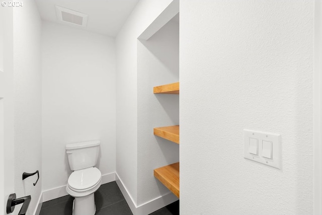 bathroom featuring toilet