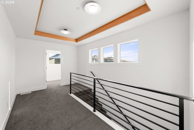 17007 NE 82nd St, Vancouver, WA 98682 - corridor featuring dark colored carpet, baseboards, a raised ceiling, and an upstairs landing