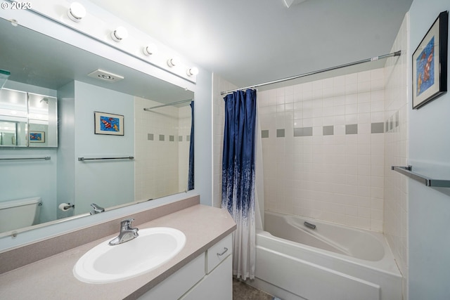 full bathroom featuring shower / tub combo, toilet, and vanity