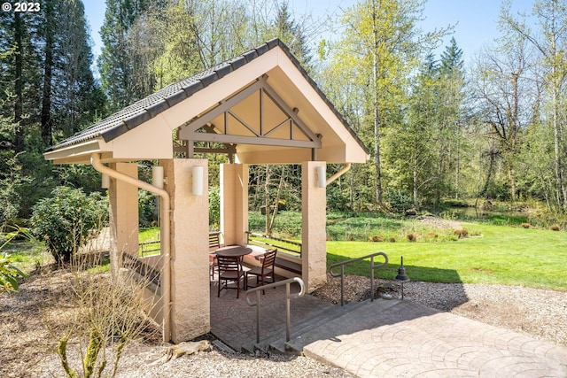 surrounding community with a gazebo, a yard, and a patio