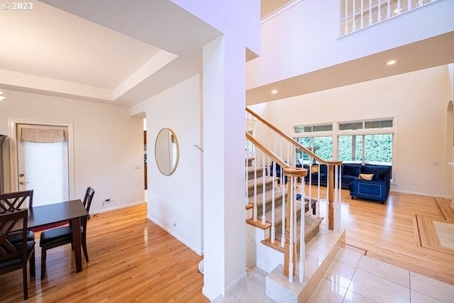 stairs featuring hardwood / wood-style floors