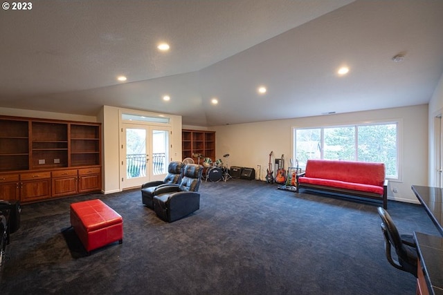 living room with french doors, vaulted ceiling, and dark colored carpet