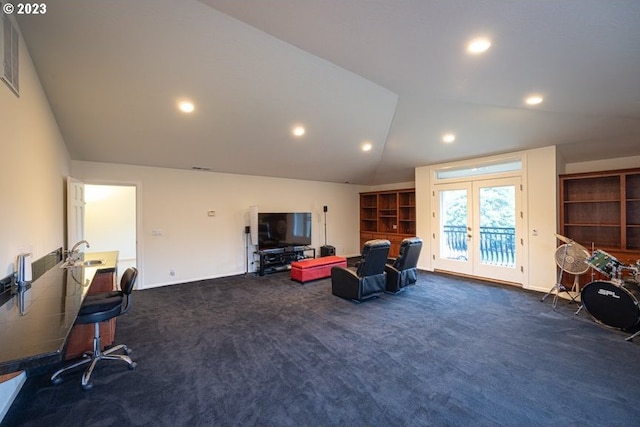 carpeted living room featuring french doors and lofted ceiling