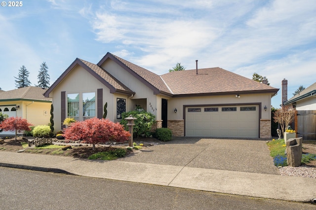 ranch-style house with an attached garage, driveway, and stone siding