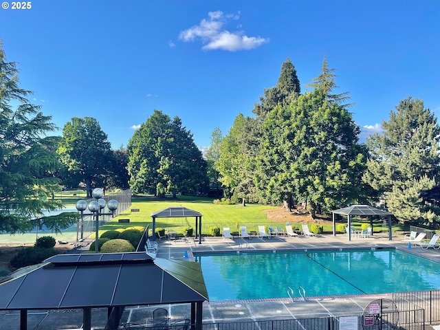 pool with a gazebo and a lawn