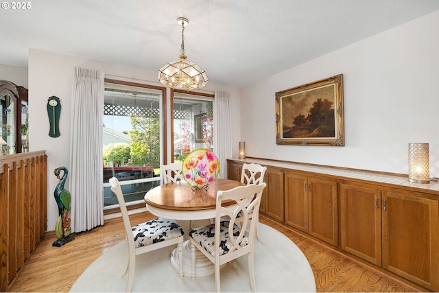 2037 NE 158th Pl, Portland, OR 97230 - dining room with a chandelier and light wood finished floors