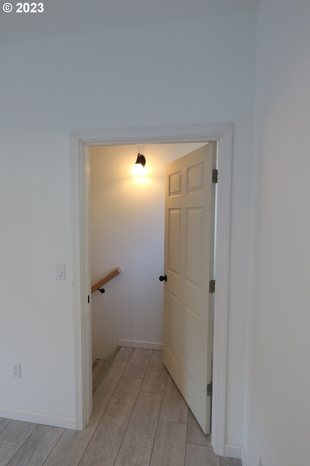 interior space featuring wood finish floors and baseboards